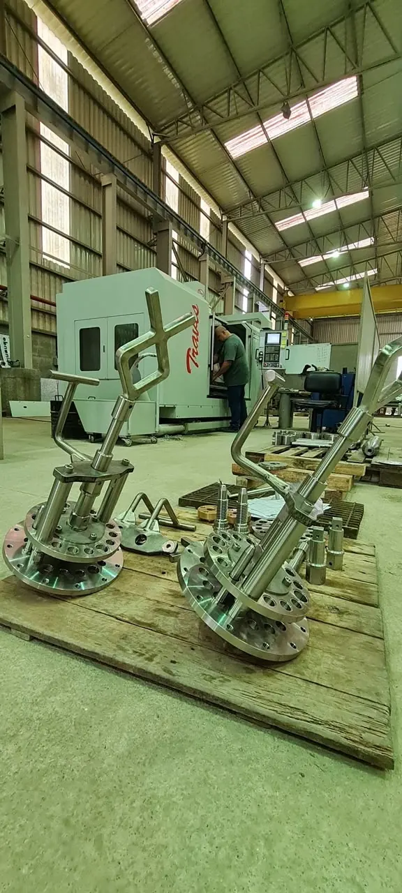 Machined ROV tools in front of the Travis machining center